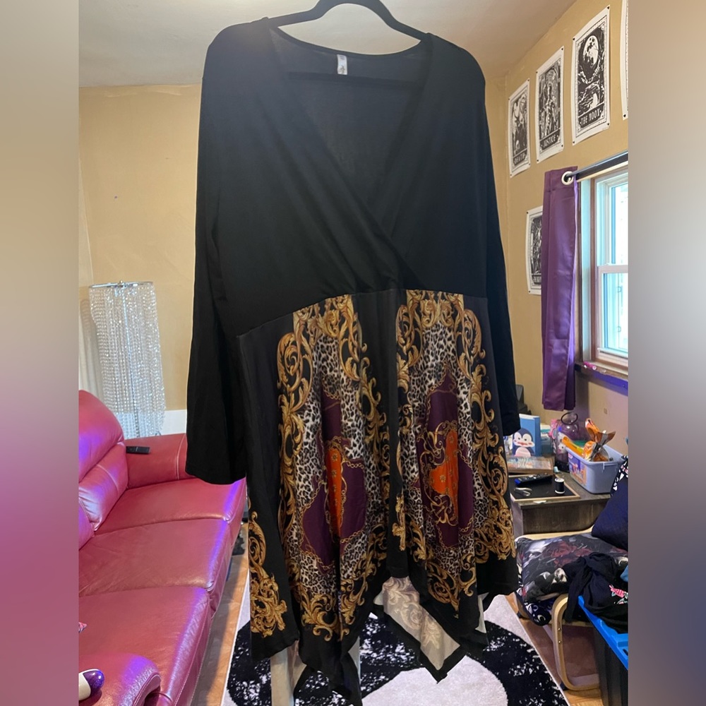 Handkerchief dress with satiny skirt. Low cut neckline.